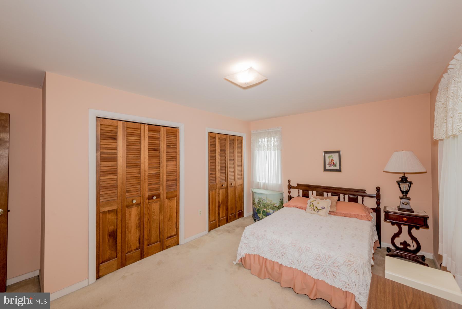 4414 Salem Bottom Road Westminster, MD 21157 - Photo 15 of 30 a bedroom with a large bed and a closet