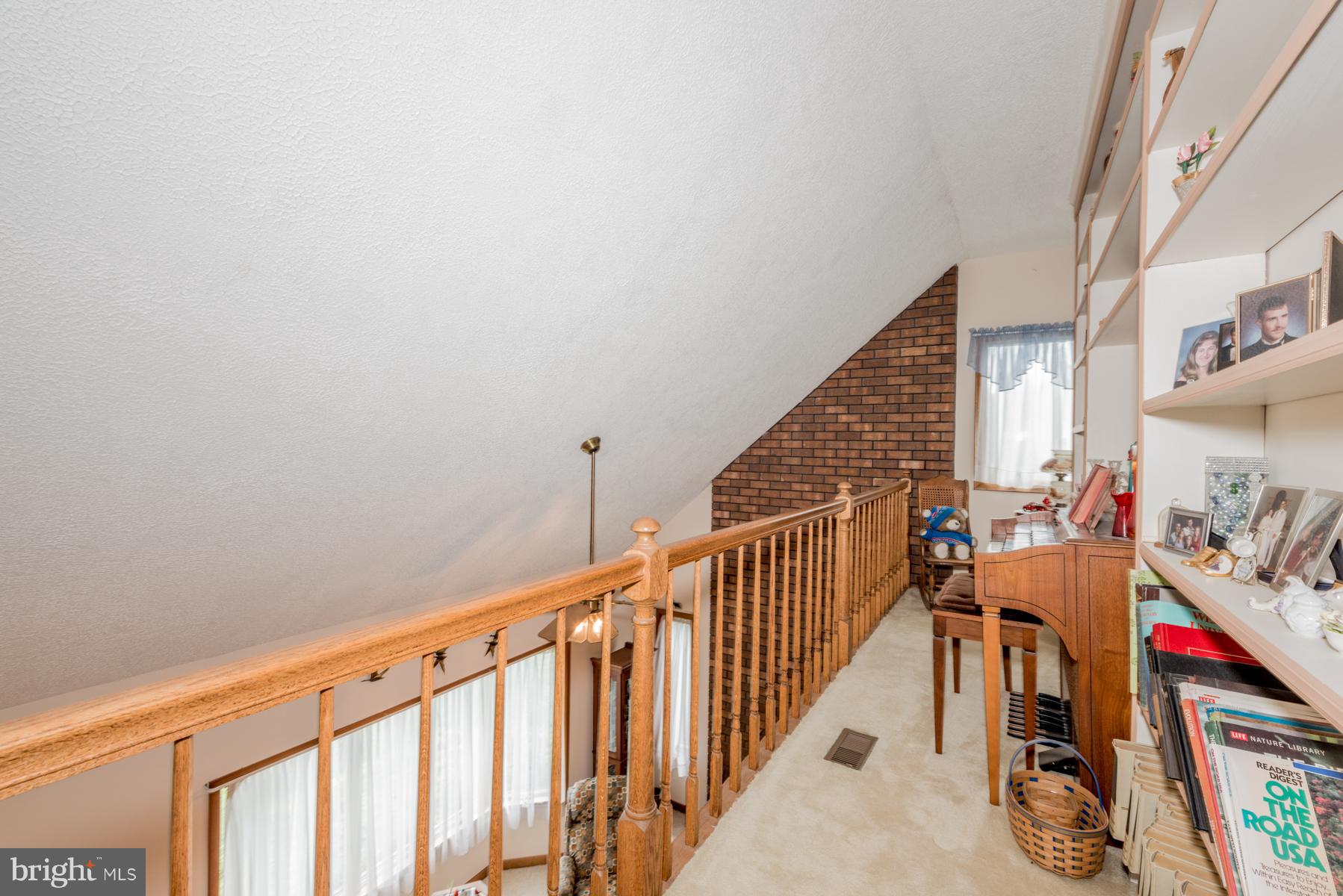 4414 Salem Bottom Road Westminster, MD 21157 - Photo 18 of 30 a view of a hallway with wooden floor and stairs