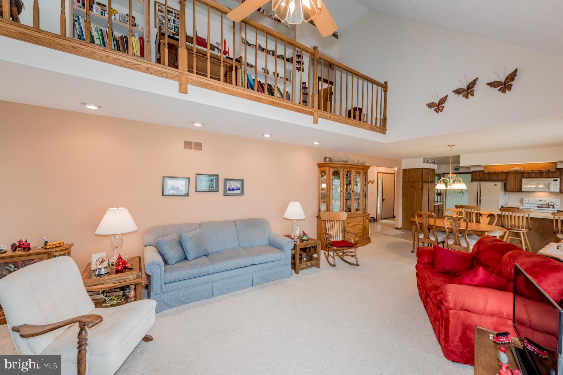 4414 Salem Bottom Road Westminster, MD 21157 - Photo 21 of 30 a living room with furniture and a chandelier