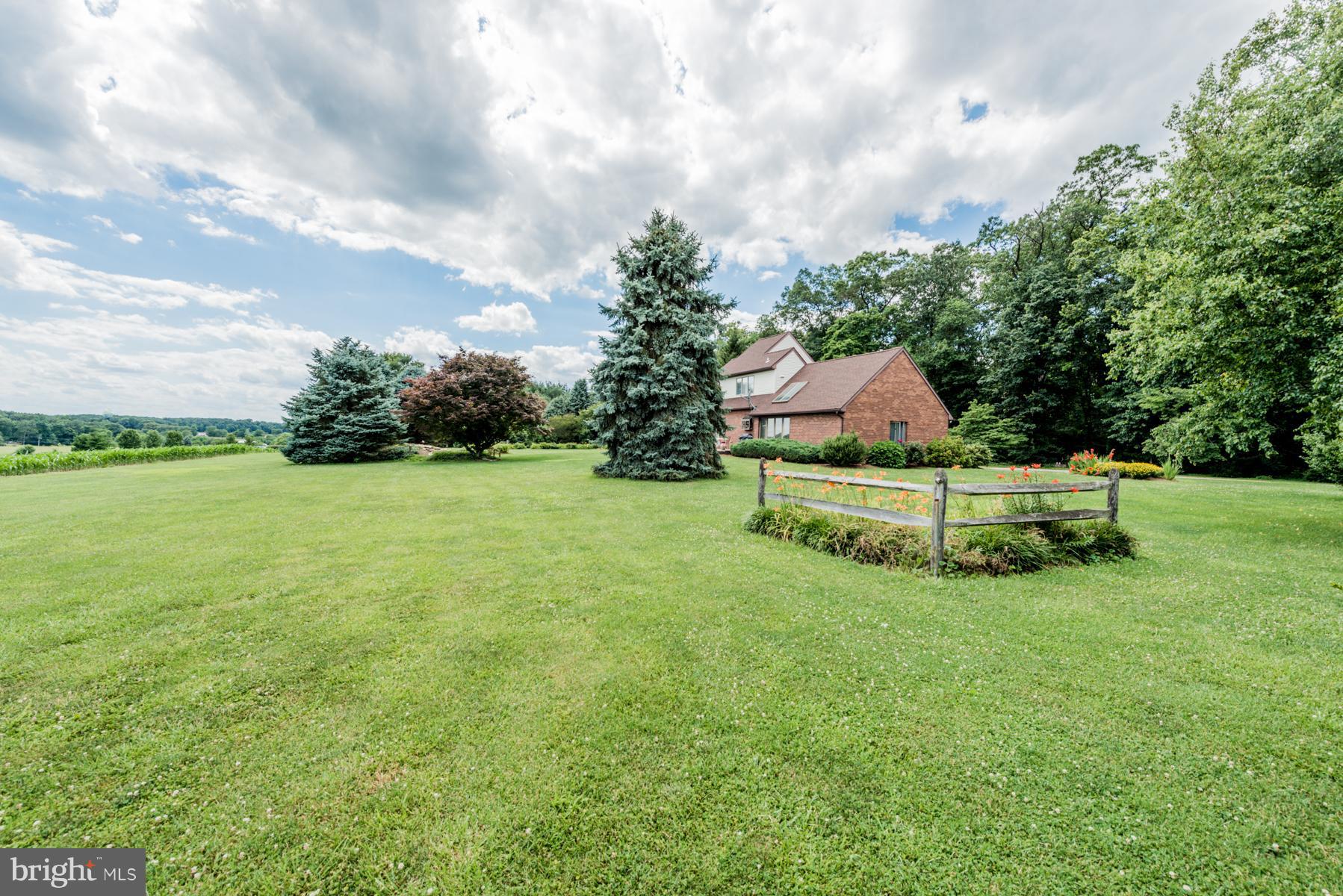 4414 Salem Bottom Road Westminster, MD 21157 - Photo 27 of 30 a view of a house with a big yard and a fountain