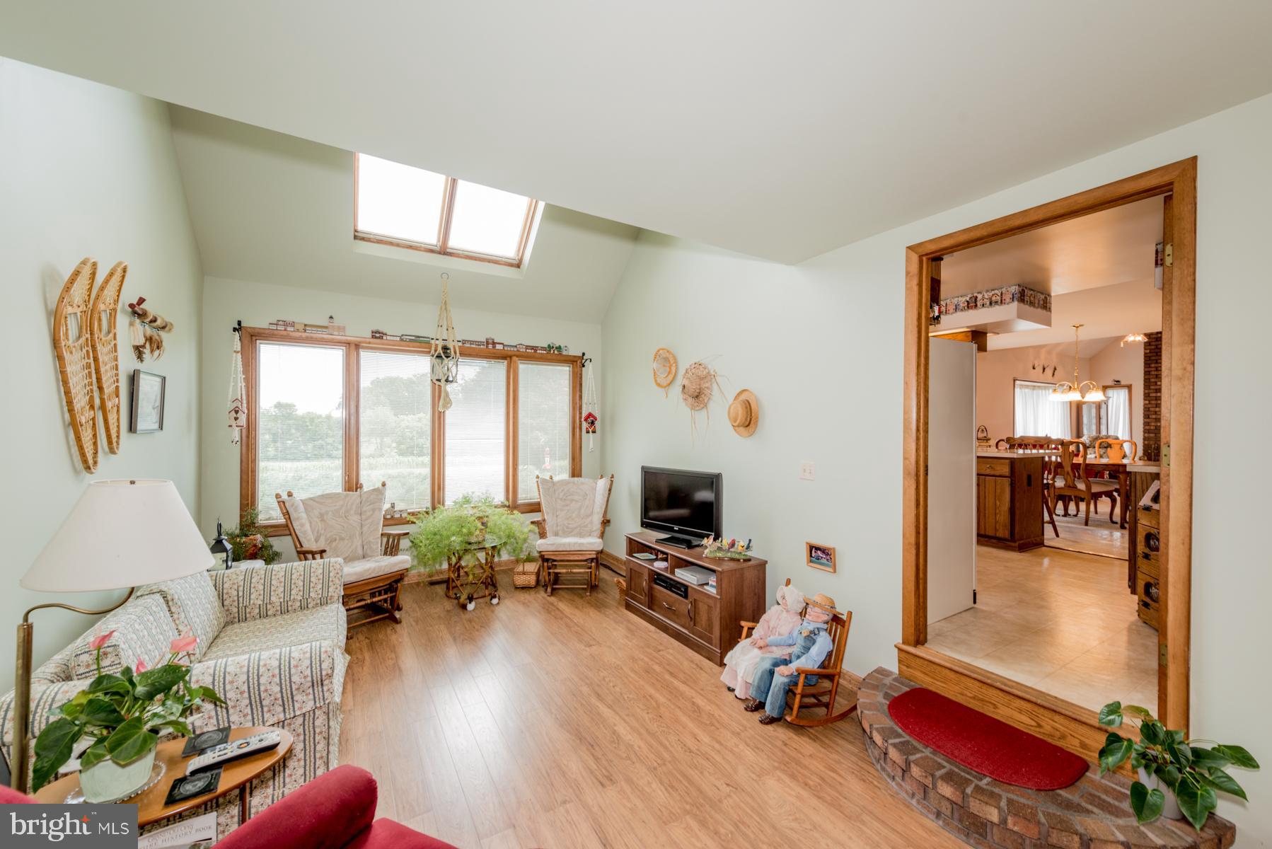 4414 Salem Bottom Road Westminster, MD 21157 - Photo 5 of 30 a living room with furniture gym equipment and a large window