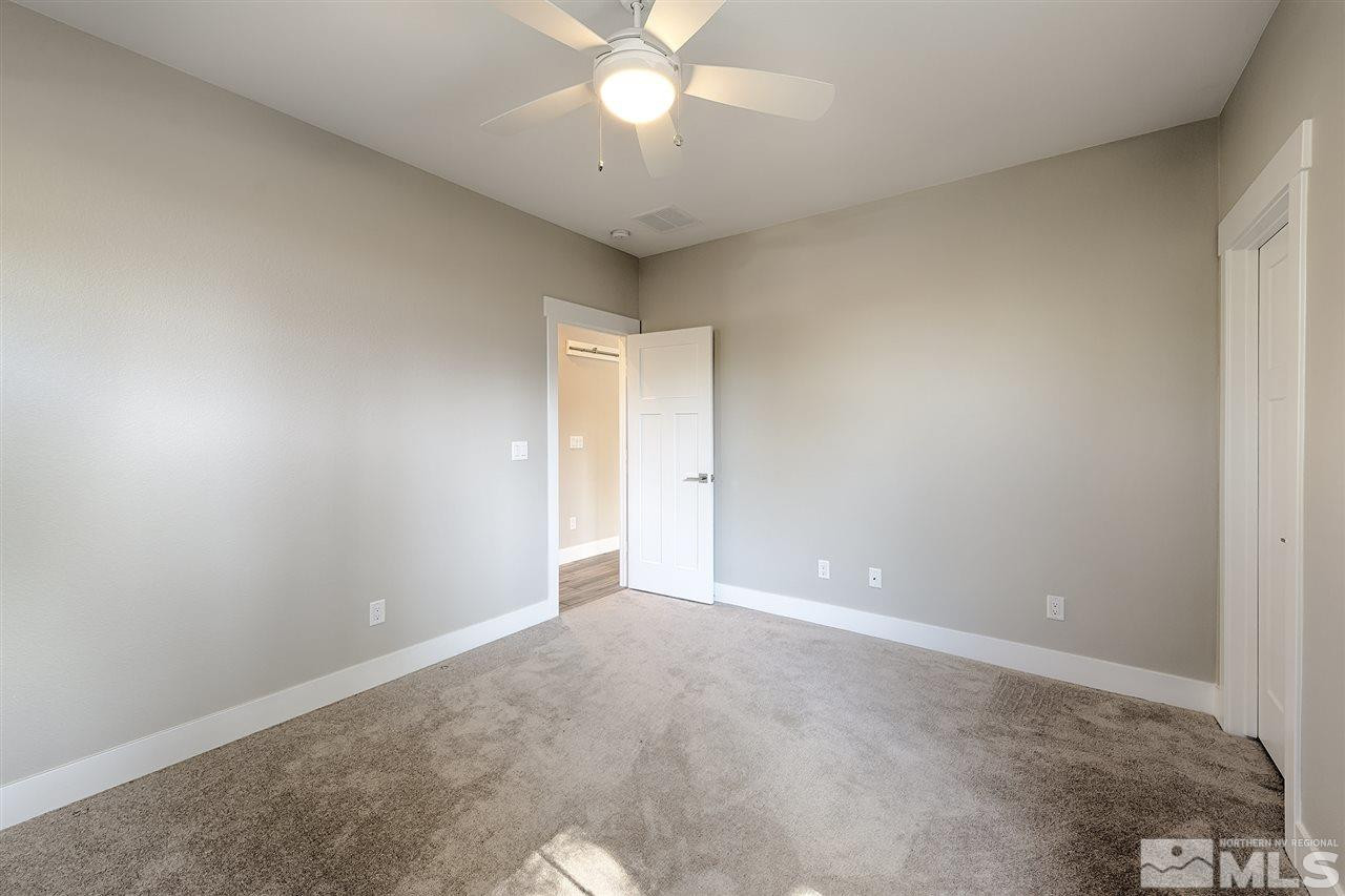 1364 Charles Drive Reno, NV 89509 - Photo 13 of 18 an empty room with a ceiling fan and a window