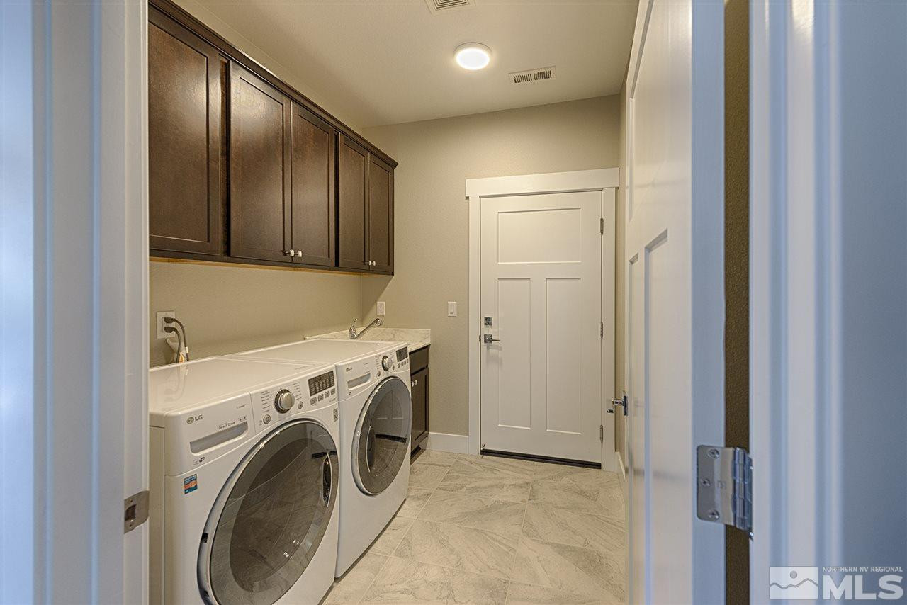 1364 Charles Drive Reno, NV 89509 - Photo 15 of 18 a view of a hallway with washer and dryer