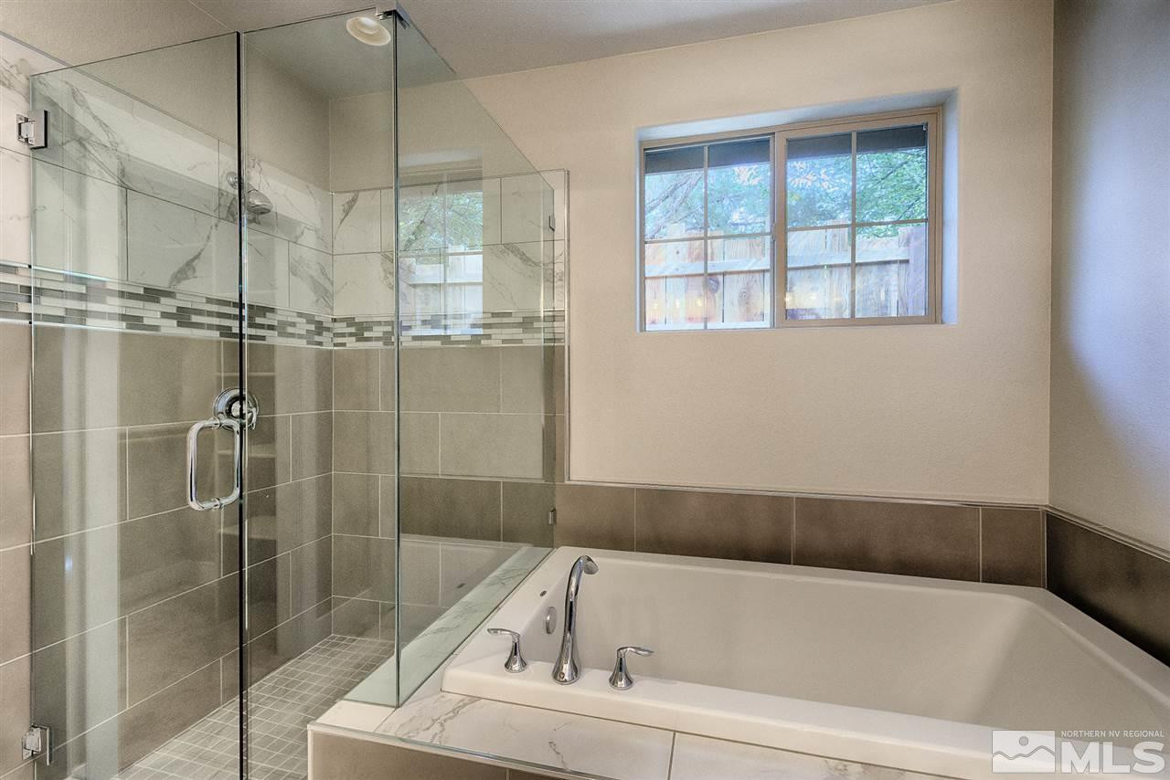 1364 Charles Drive Reno, NV 89509 - Photo 16 of 18 a bathroom with a tub and a shower