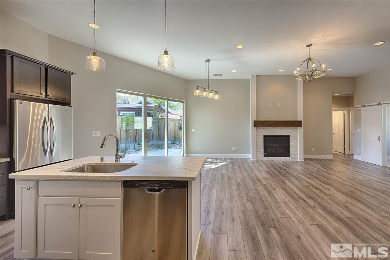 1364 Charles Drive Reno, NV 89509 - Photo 7 of 18 a kitchen with kitchen island a sink stainless steel appliances and cabinets