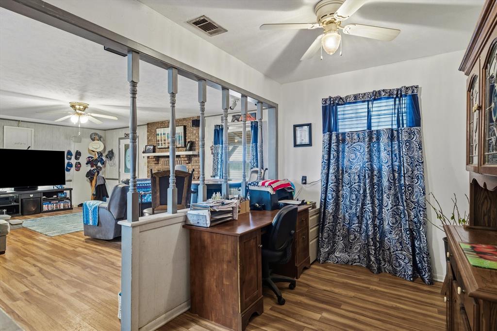 1571 VZ County Road Ben Wheeler, TX 75754 - Photo 19 of 39 a view of a workspace with furniture and a flat screen tv