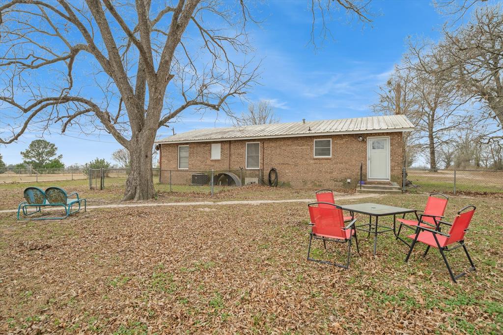 1571 VZ County Road Ben Wheeler, TX 75754 - Photo 23 of 39 a backyard of a house with table and chairs