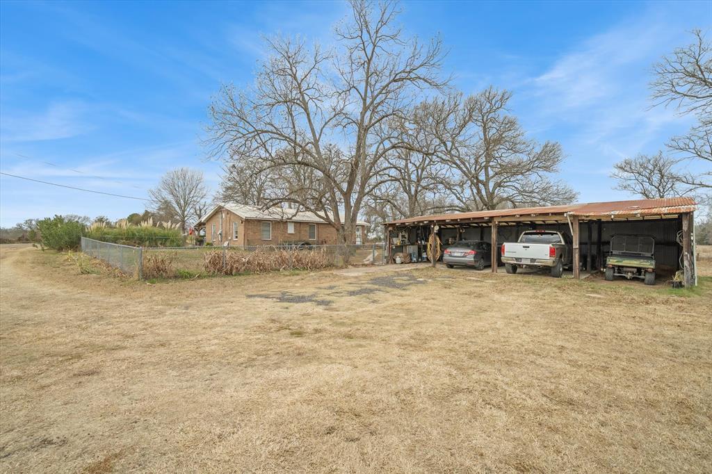 1571 VZ County Road Ben Wheeler, TX 75754 - Photo 25 of 39 a front view of a house with a yard and garage