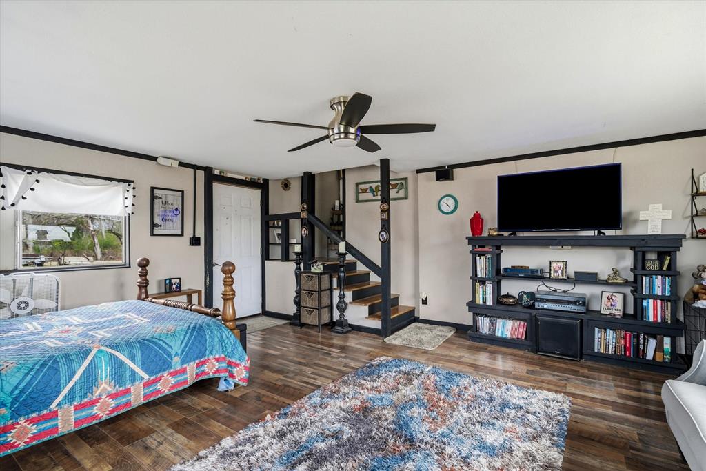 1571 VZ County Road Ben Wheeler, TX 75754 - Photo 28 of 39 a bedroom with a bed a flat screen tv and dresser