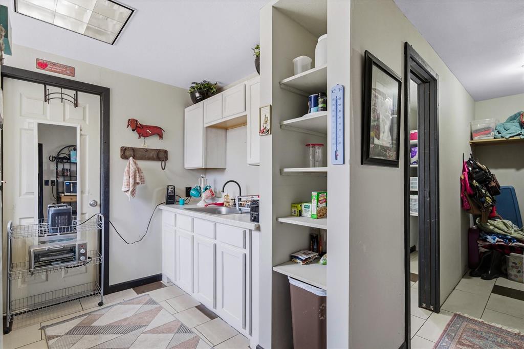 1571 VZ County Road Ben Wheeler, TX 75754 - Photo 30 of 39 a room with cabinets and wooden floor
