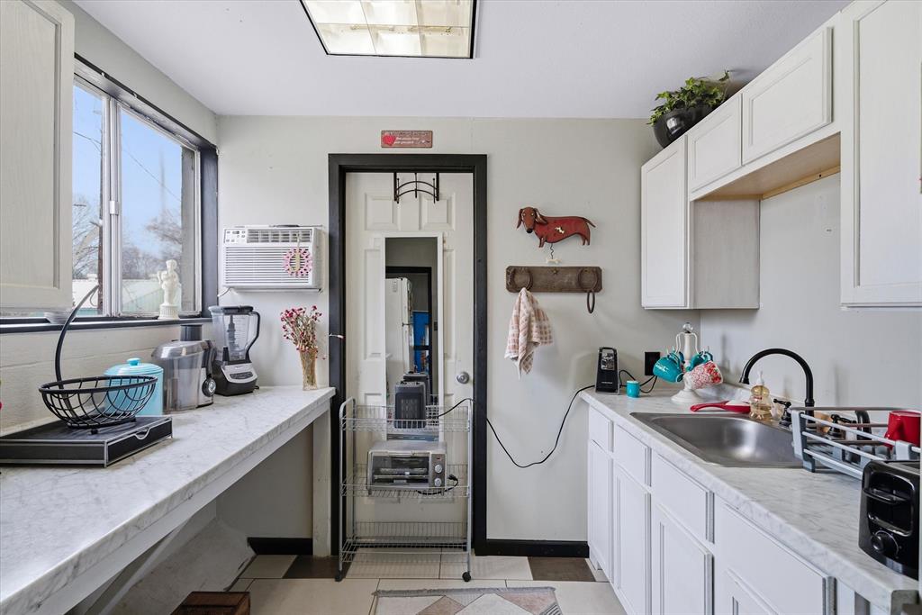 1571 VZ County Road Ben Wheeler, TX 75754 - Photo 31 of 39 a kitchen with sink refrigerator and cabinets