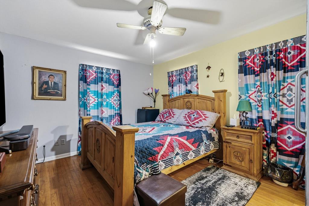 1571 VZ County Road Ben Wheeler, TX 75754 - Photo 8 of 39 a bedroom with furniture and wooden floor