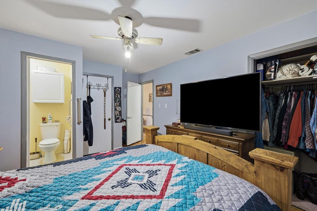 1571 VZ County Road Ben Wheeler, TX 75754 - Photo 9 of 39 a bedroom with a bed and a flat screen tv