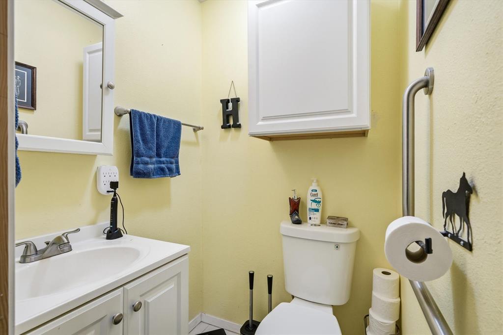 1571 VZ County Road Ben Wheeler, TX 75754 - Photo 10 of 39 a bathroom with a sink mirror and toilet