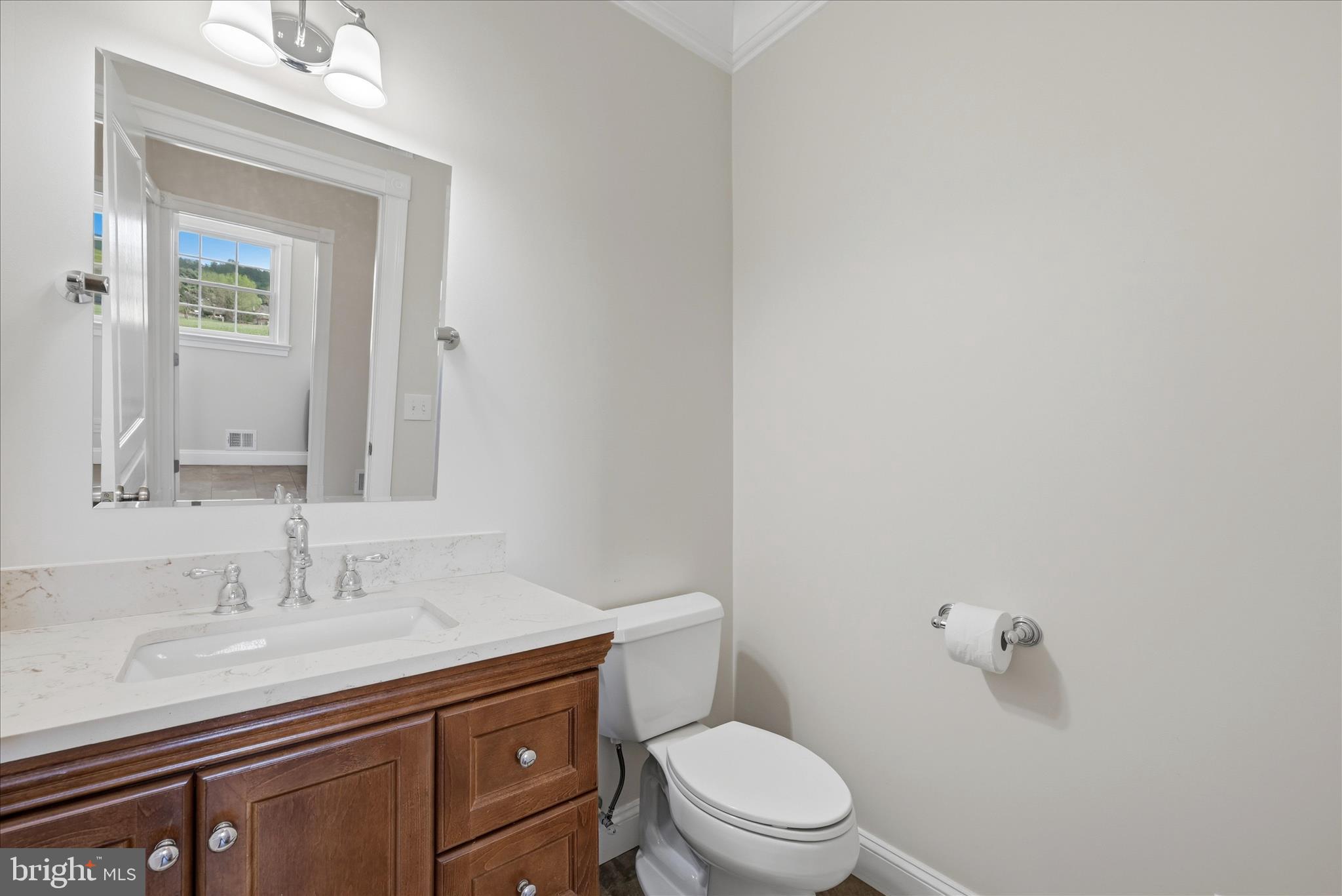 2230 Jones Road Winchester, VA 22602 - Photo 23 of 83 a bathroom with a granite countertop sink a toilet and a mirror