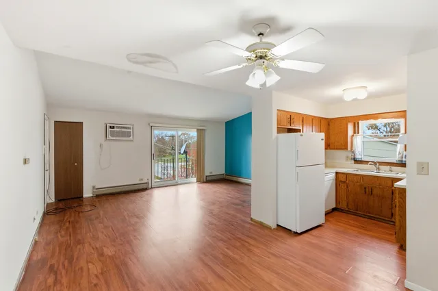 a kitchen with a sink cabinets and window