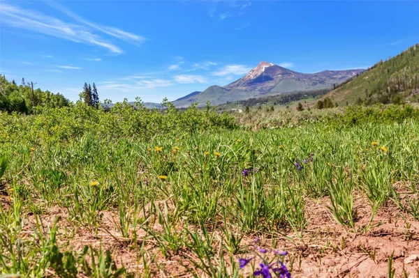 a view of mountain view with mountains in the background