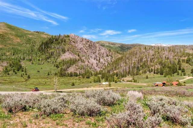 a view of a town with mountains
