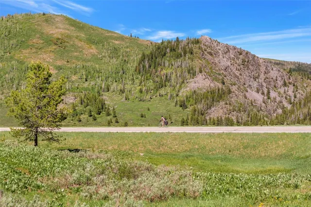 a view of an ocean from a mountain