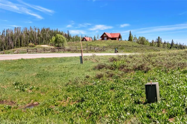 a view of a road with a yard