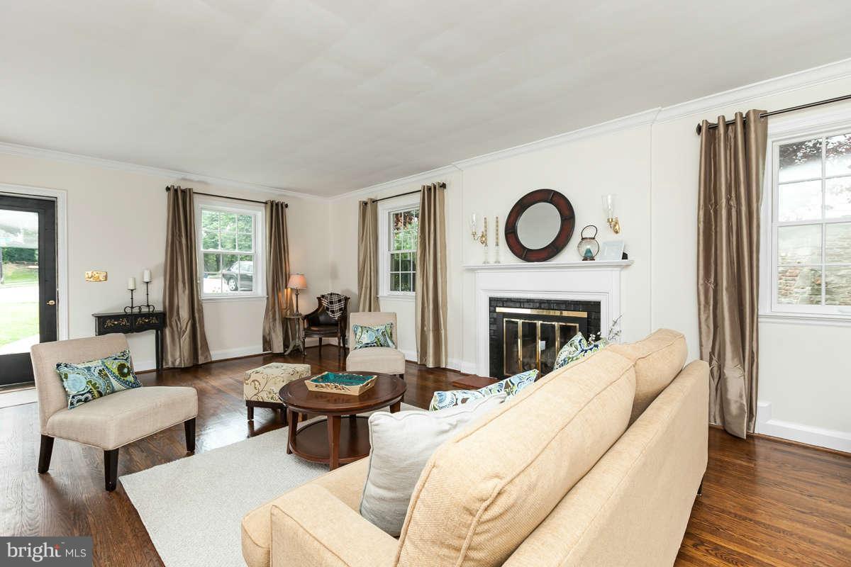 602 Hastings Road Baltimore, MD 21286 - Photo 3 of 26 a living room with furniture a fireplace and a large window