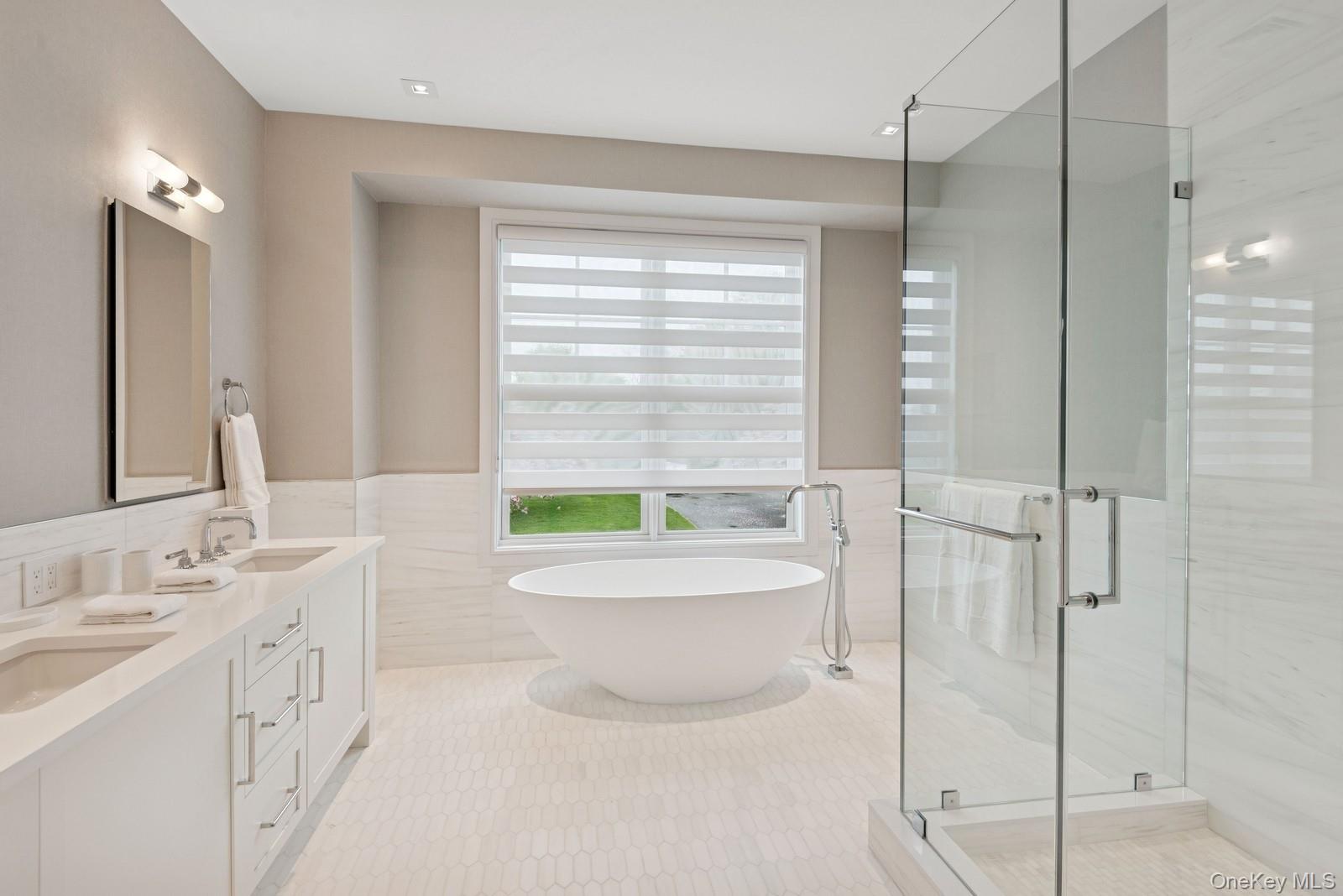 8 Magnolia Drive, Unit 2A Water Mill, NY 11976 - Photo 13 of 39 a bathroom with a toilet a sink a mirror a bathtub and shower