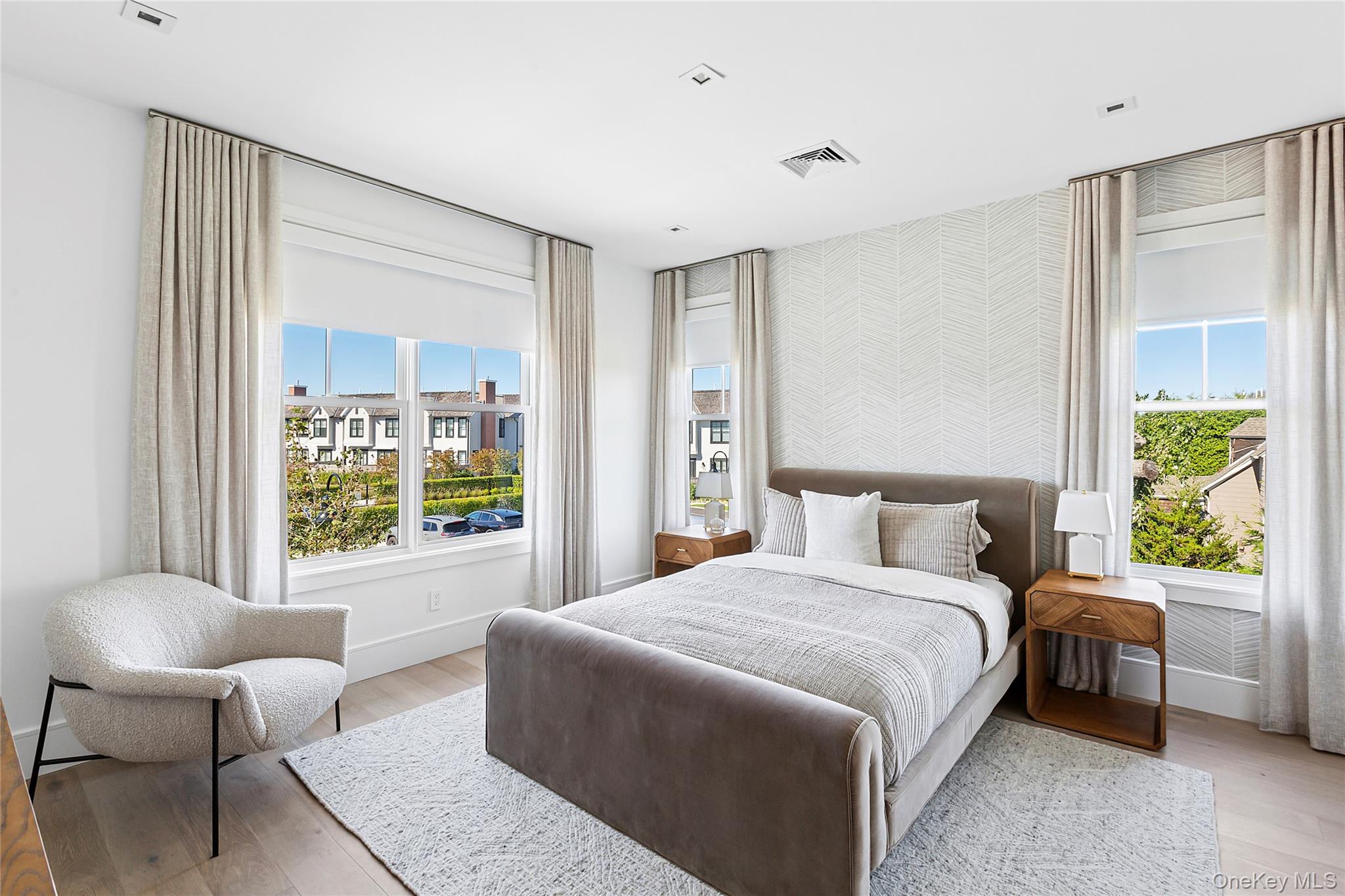 8 Magnolia Drive, Unit 2A Water Mill, NY 11976 - Photo 15 of 39 a bedroom with a bed and a couch