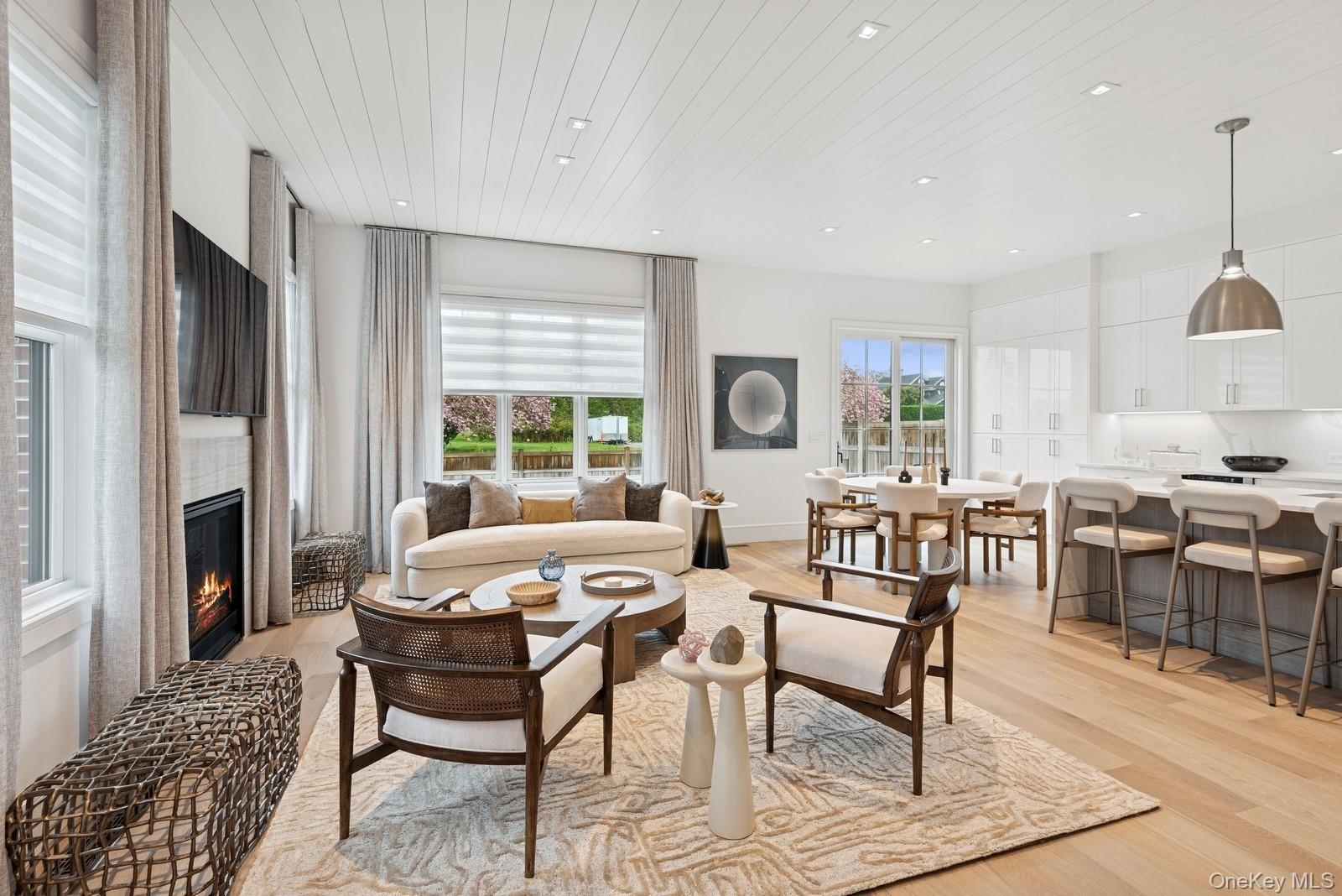 8 Magnolia Drive, Unit 2A Water Mill, NY 11976 - Photo 2 of 39 a living room with furniture and a large window