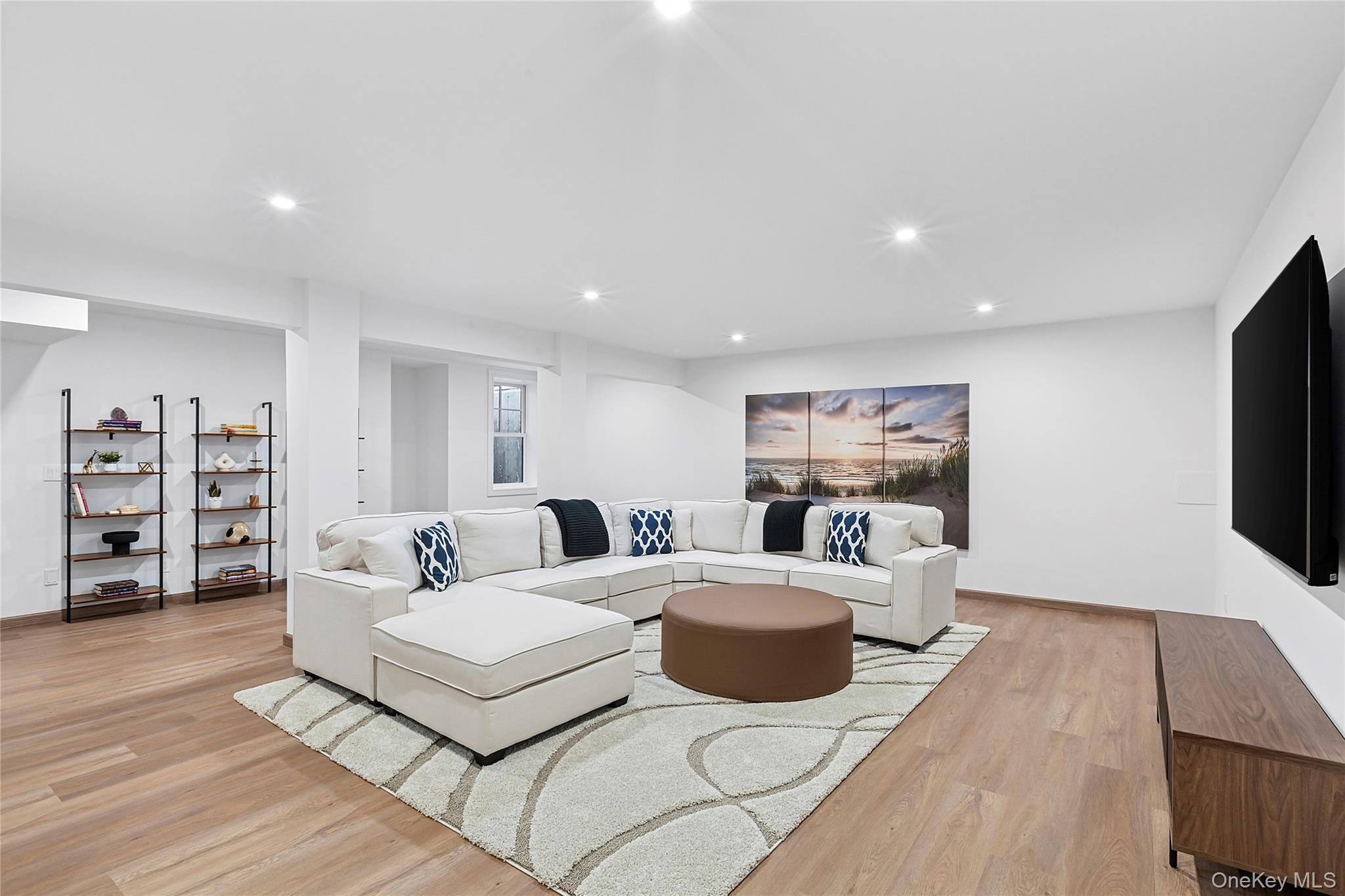 8 Magnolia Drive, Unit 2A Water Mill, NY 11976 - Photo 20 of 39 a living room with furniture and a flat screen tv
