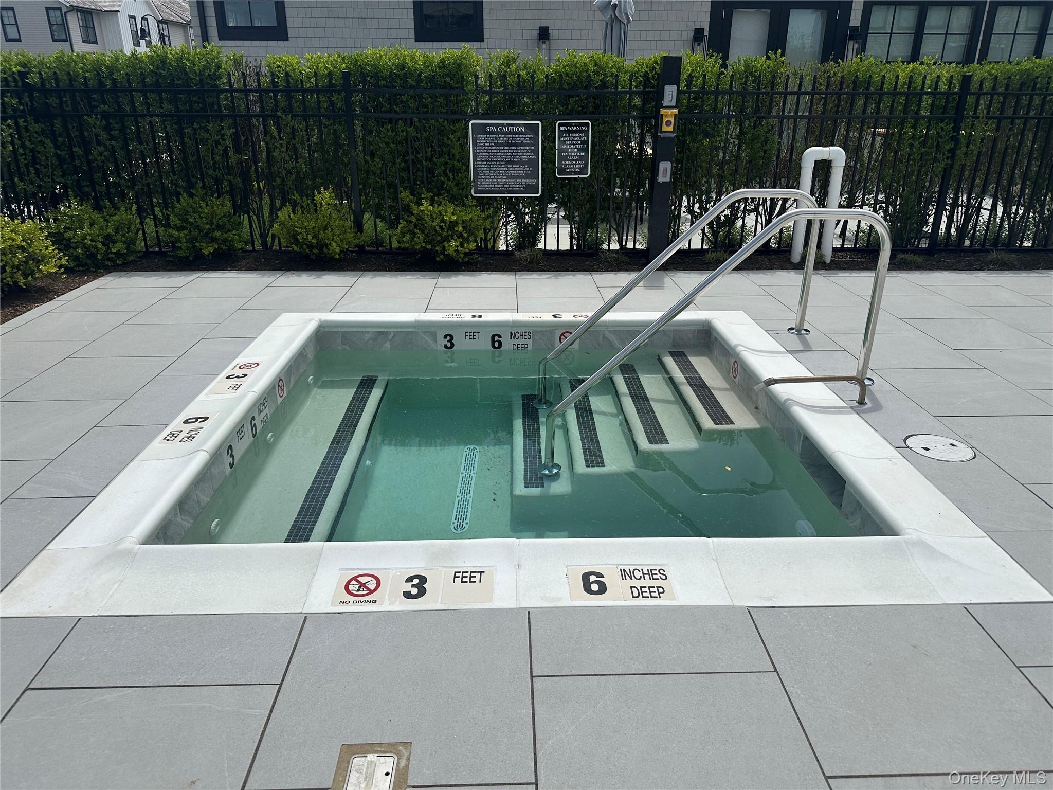 8 Magnolia Drive, Unit 2A Water Mill, NY 11976 - Photo 22 of 39 a view of swimming pool with patio