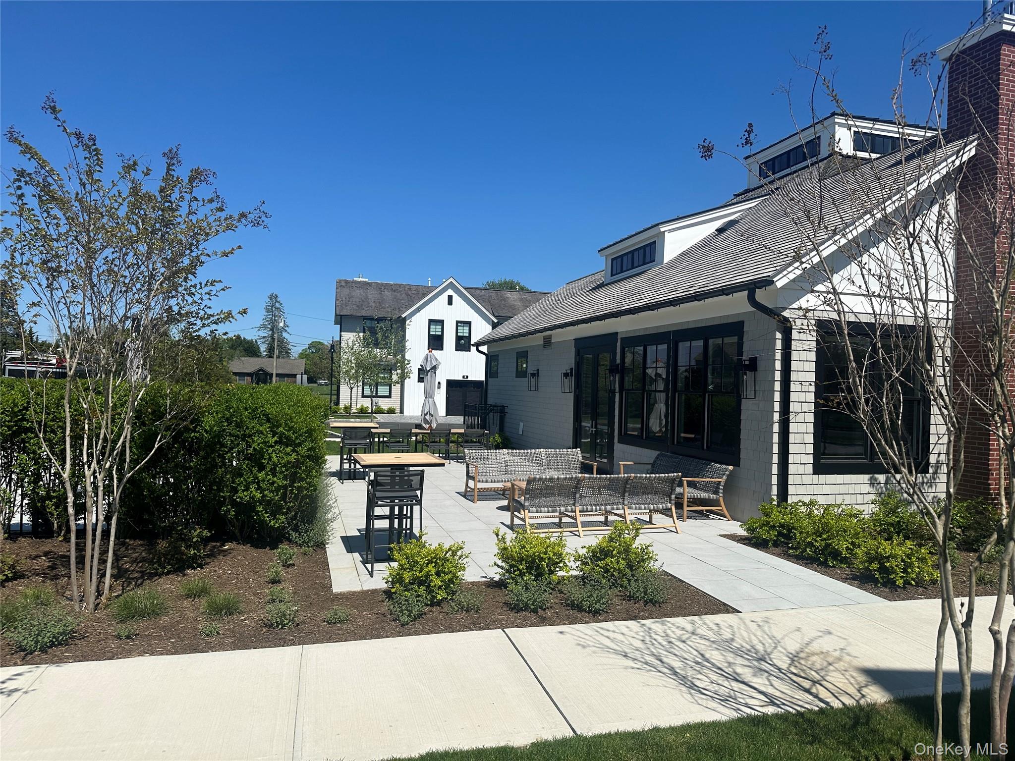 8 Magnolia Drive, Unit 2A Water Mill, NY 11976 - Photo 23 of 39 a view of house with yard outdoor seating and entertaining space