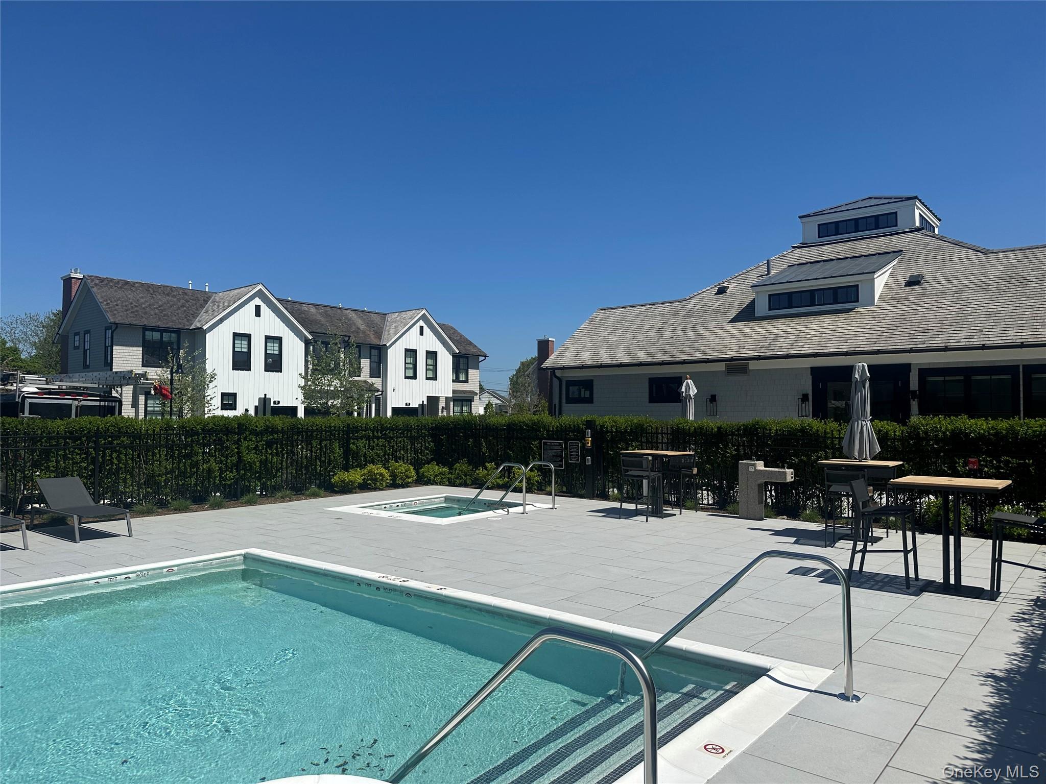8 Magnolia Drive, Unit 2A Water Mill, NY 11976 - Photo 24 of 39 a view of a house with sitting area and yard