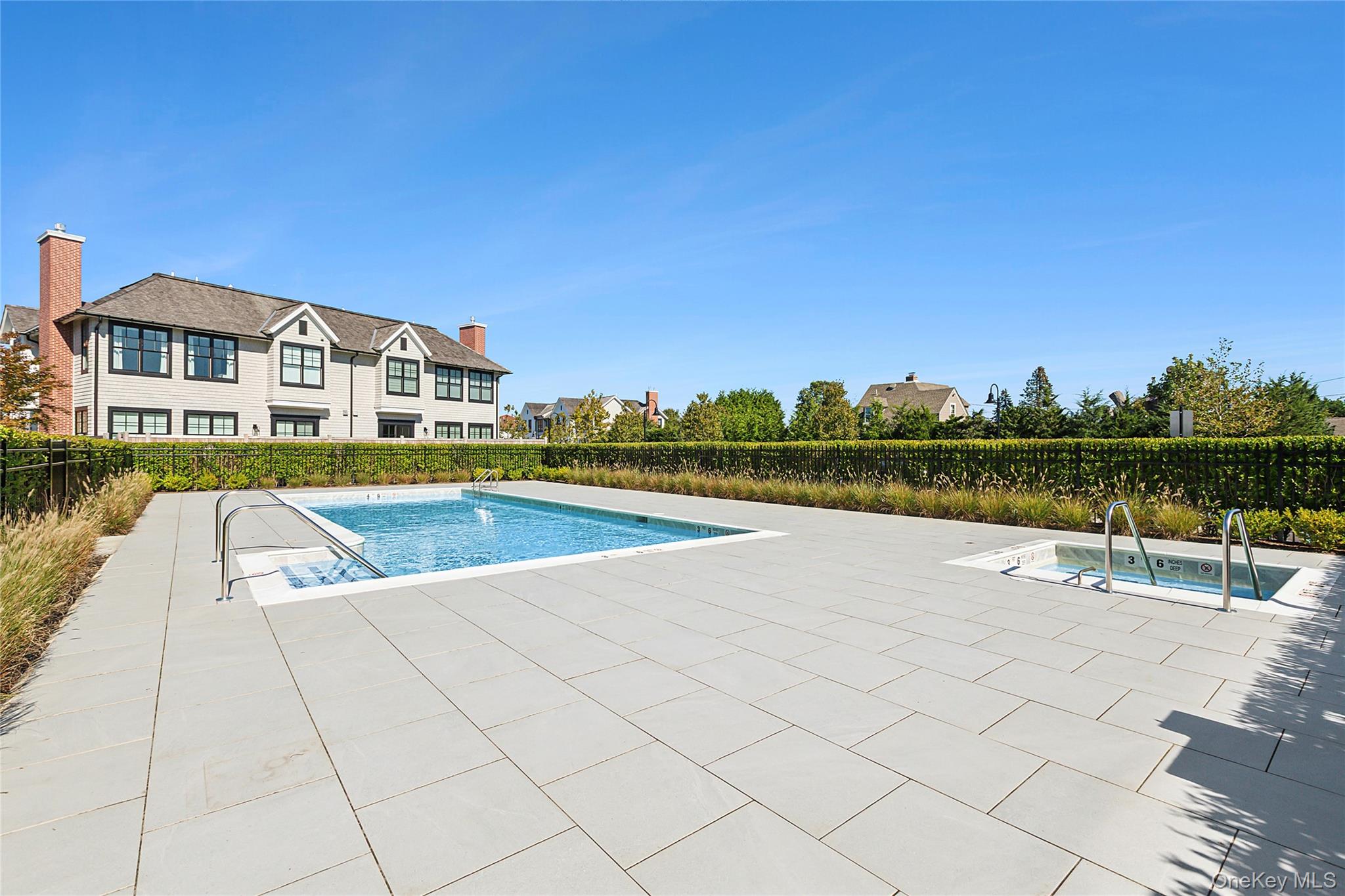 8 Magnolia Drive, Unit 2A Water Mill, NY 11976 - Photo 25 of 39 a view of a house with pool and a yard