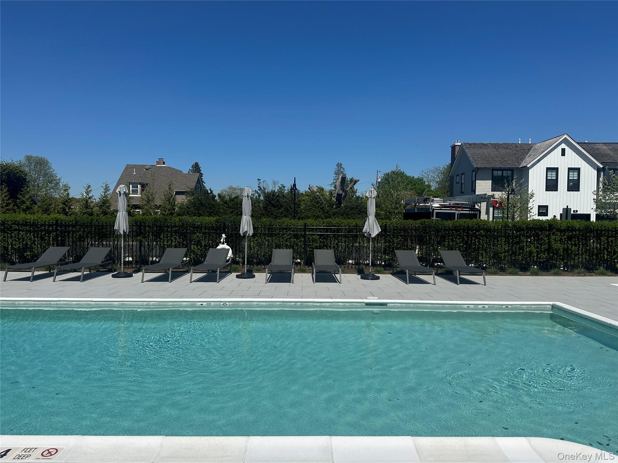 8 Magnolia Drive, Unit 2A Water Mill, NY 11976 - Photo 26 of 39 a view of a house with backyard porch and sitting area