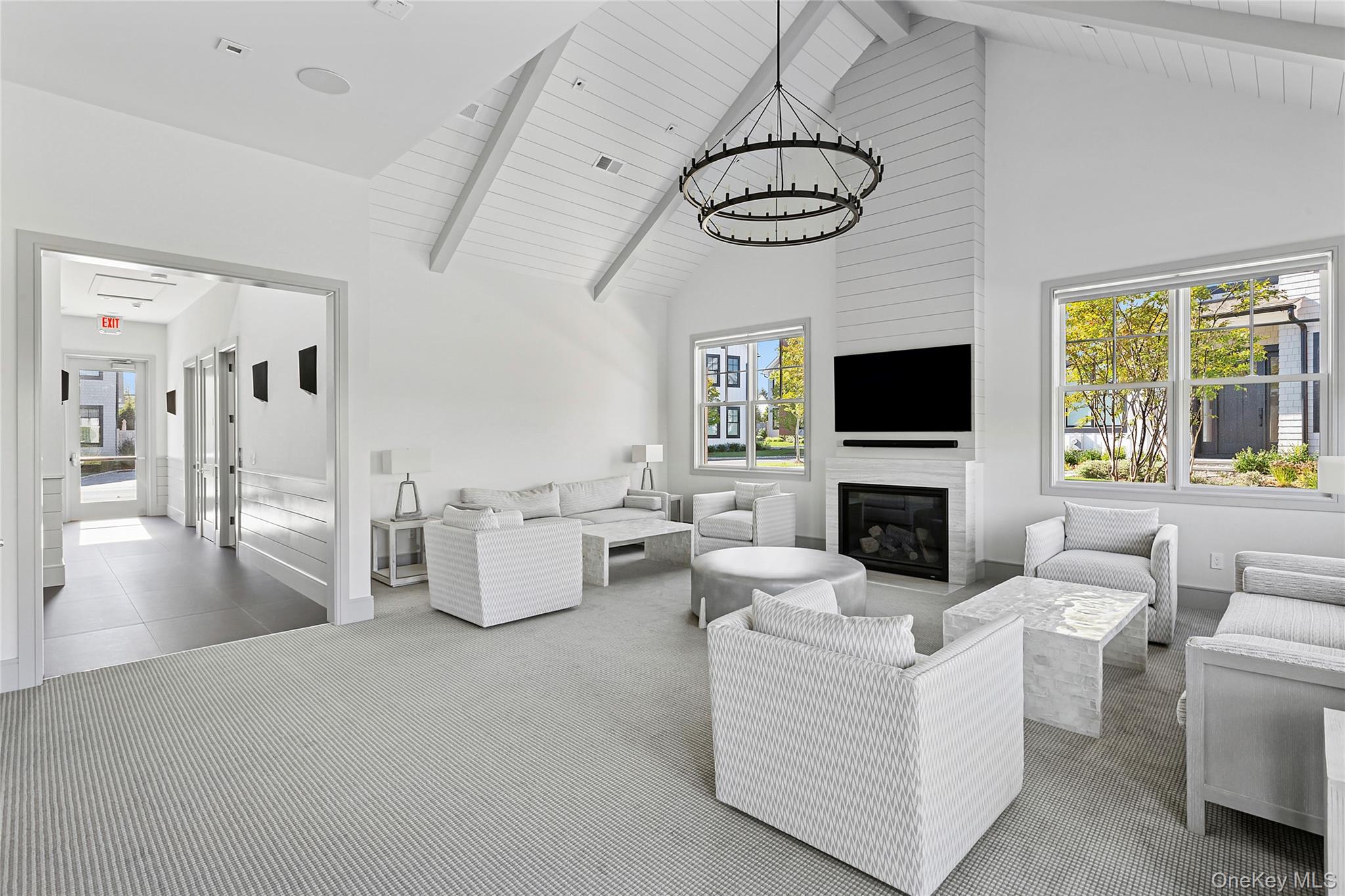 8 Magnolia Drive, Unit 2A Water Mill, NY 11976 - Photo 31 of 39 a living room with furniture and a flat screen tv