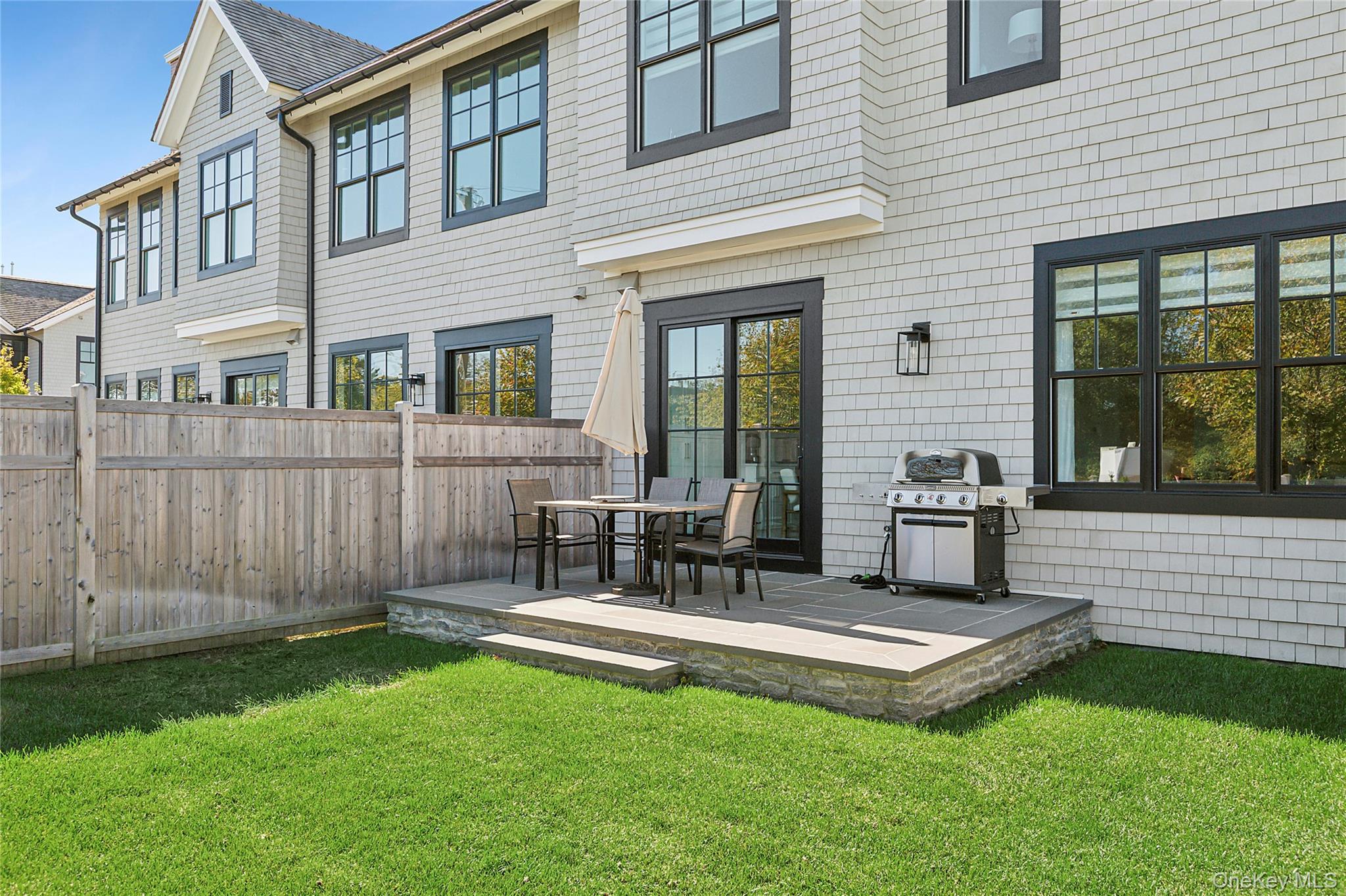 8 Magnolia Drive, Unit 2A Water Mill, NY 11976 - Photo 34 of 39 a view of a house with a backyard