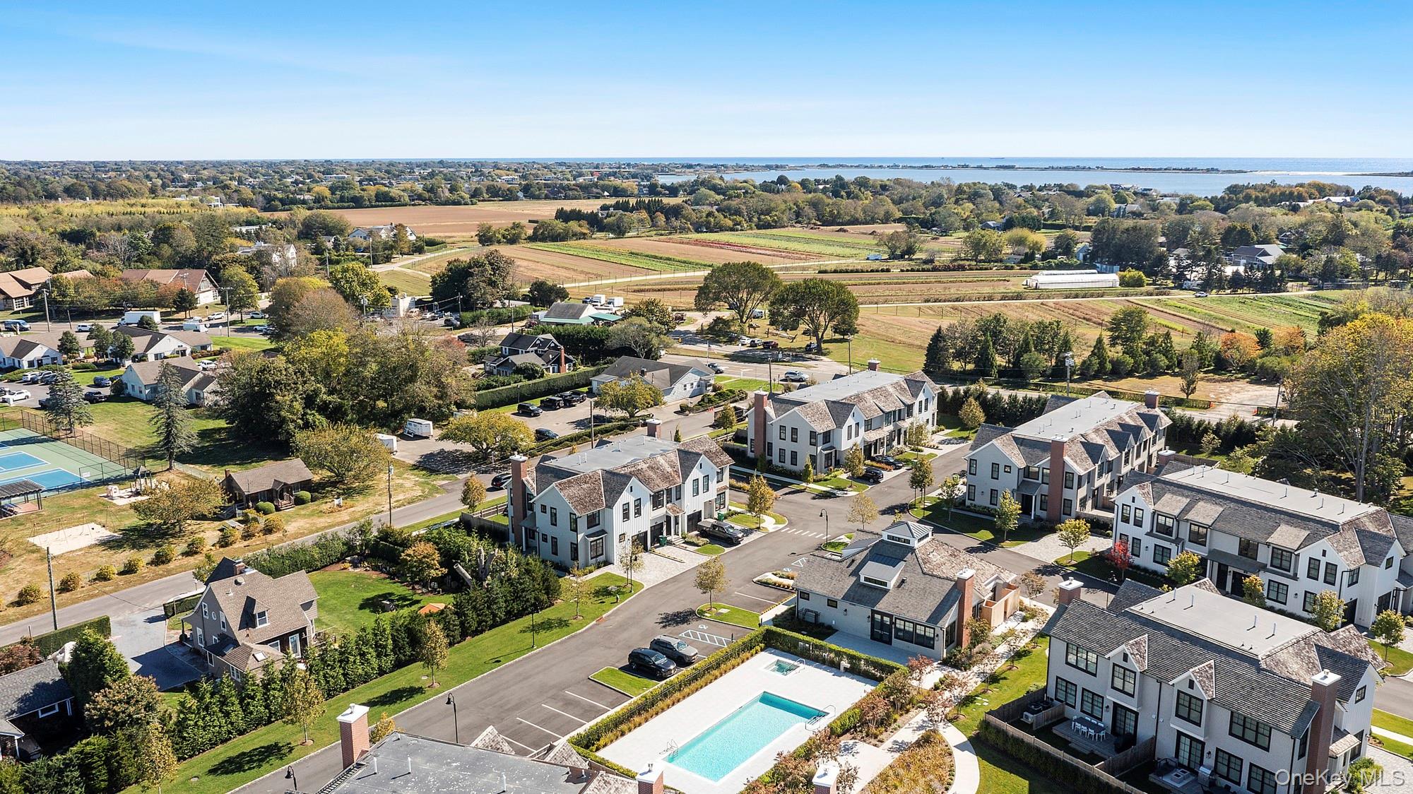 8 Magnolia Drive, Unit 2A Water Mill, NY 11976 - Photo 38 of 39 an aerial view of a city with parking space