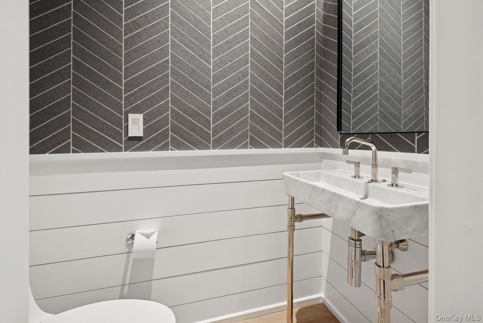 8 Magnolia Drive, Unit 2A Water Mill, NY 11976 - Photo 6 of 39 a bathroom with a sink and mirror