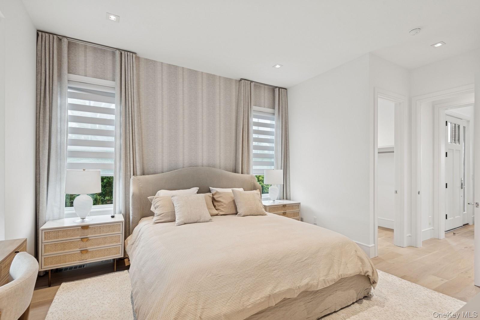 8 Magnolia Drive, Unit 2A Water Mill, NY 11976 - Photo 7 of 39 a bedroom with a large bed and a window