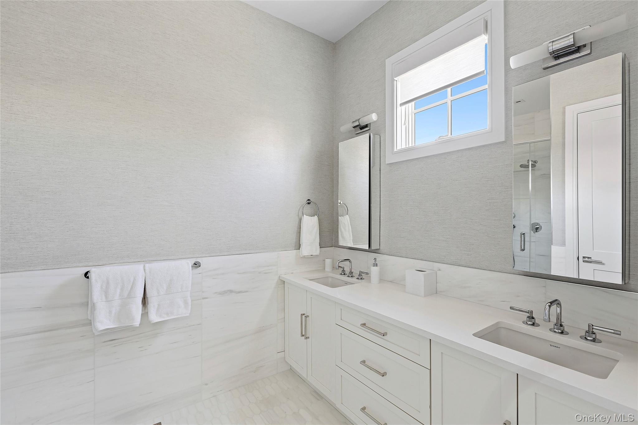 8 Magnolia Drive, Unit 2A Water Mill, NY 11976 - Photo 8 of 39 a bathroom with a sink vanity and mirror