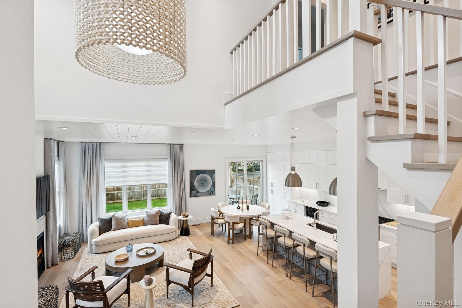 8 Magnolia Drive, Unit 2A Water Mill, NY 11976 - Photo 9 of 39 a living room with furniture and a large window