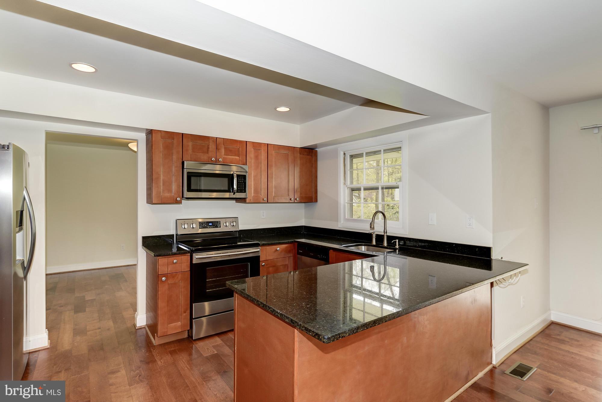 12604 Ivystone Lane Laurel, MD 20708 - Photo 10 of 30 Granite countertops adorn the upgraded kitchen