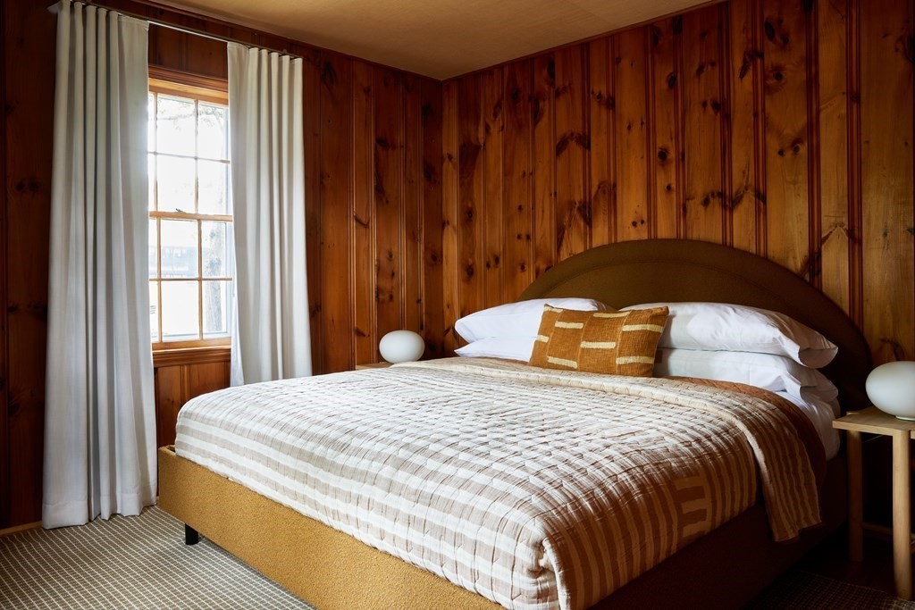 30 Manning Road Dennis Port, MA 02639 - Photo 6 of 10 a bedroom with a bed and wooden floor