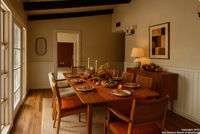 a view of a dining room with furniture and wooden floor