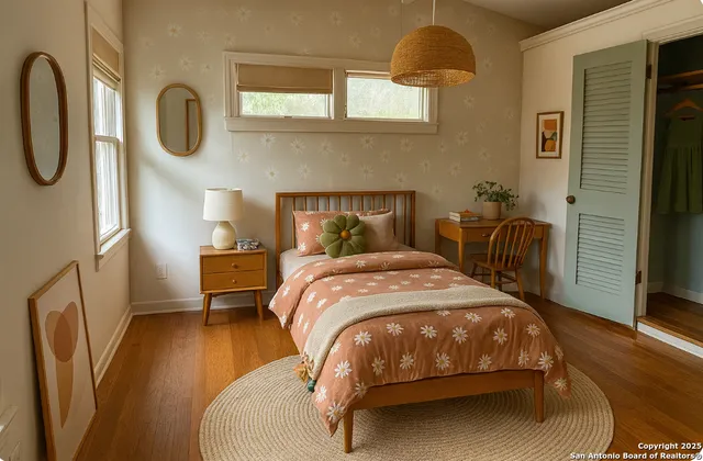 a bedroom with a bed a mirror with the dresser