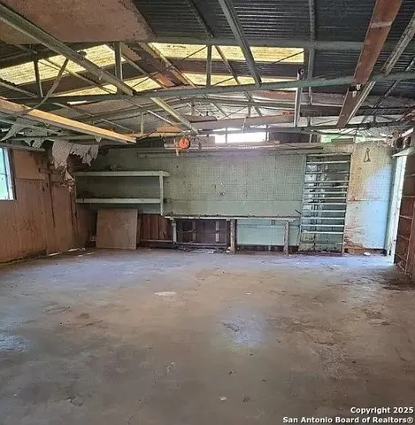 a view of a room with wooden walls
