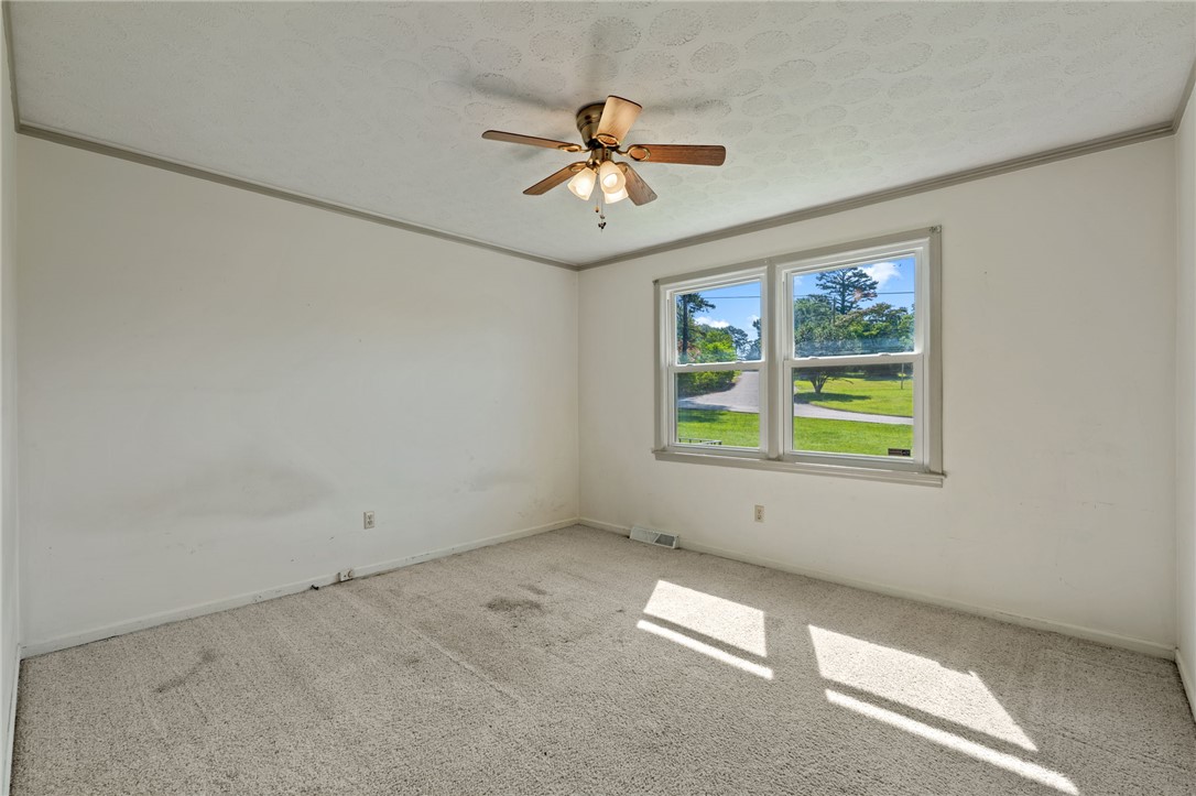 200 Echo Circle Easley, SC 29642 - Photo 17 of 35 A quiet bedroom offers ample space and natural light through broad windows, ready for personalization.