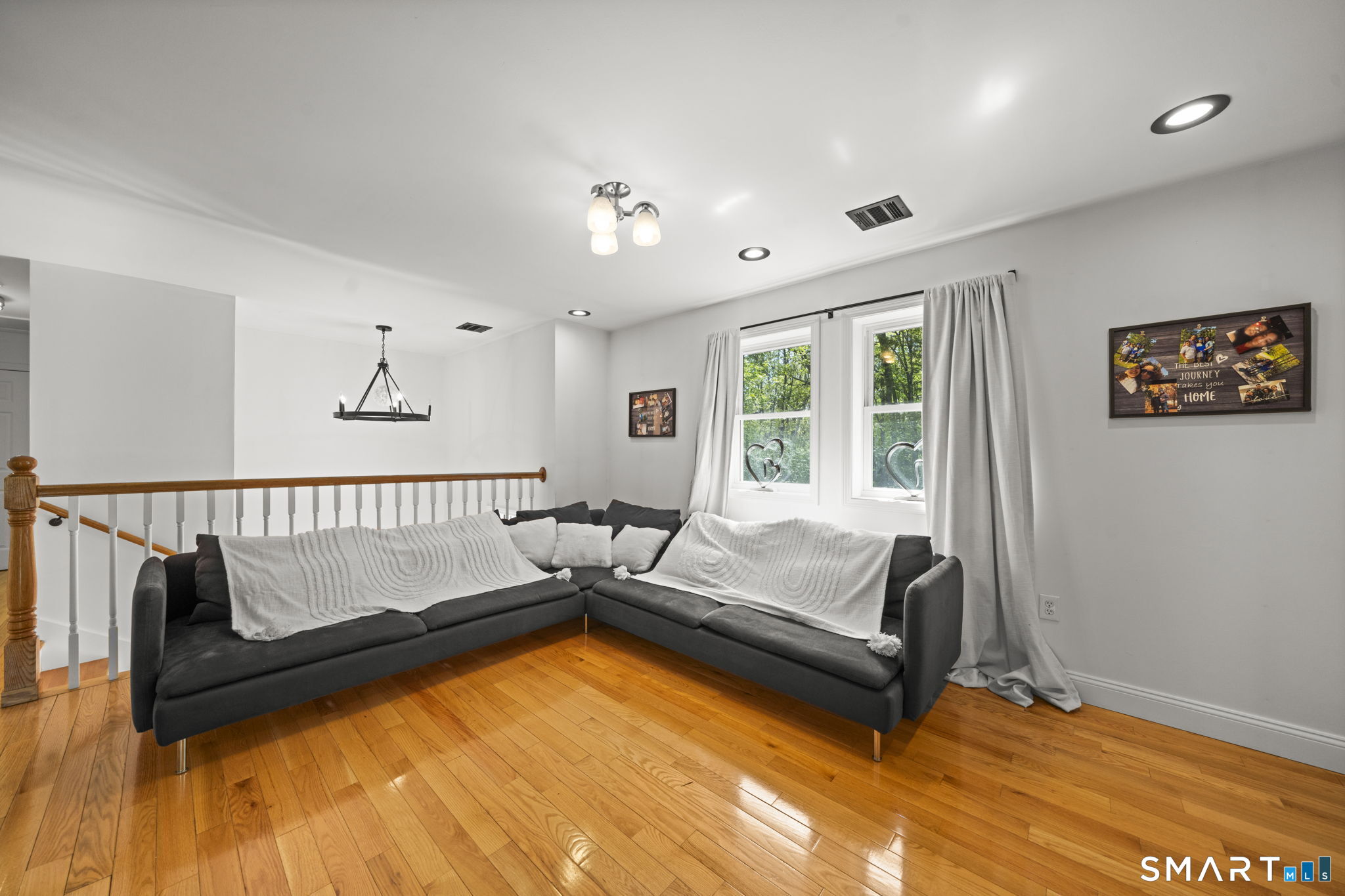 1118 Spindle Hill Road Wolcott, CT 06716 - Photo 17 of 38 a bed room with a bed and a couch