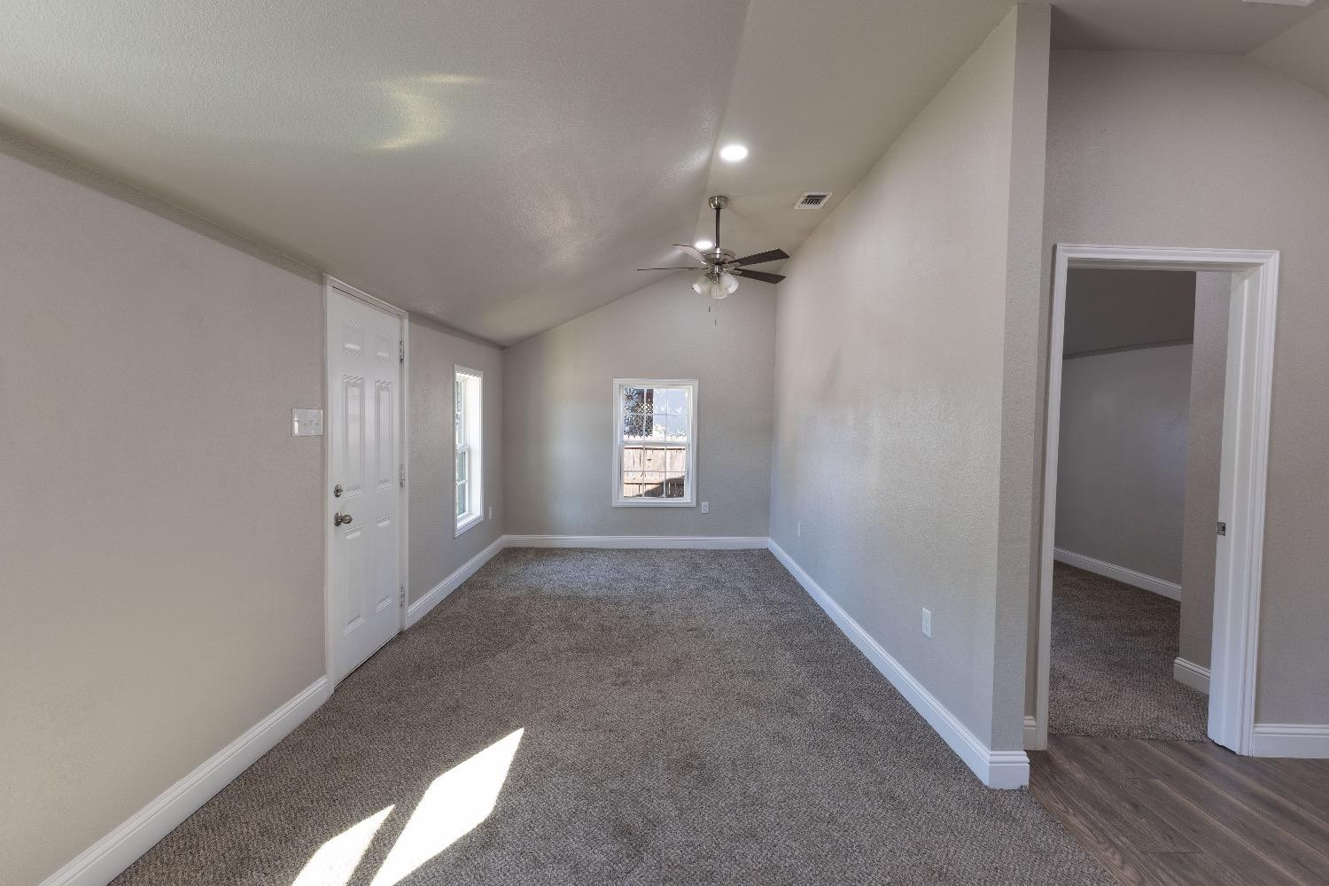 506 40th Street Lubbock, TX 79404 - Photo 3 of 17 an empty room with windows