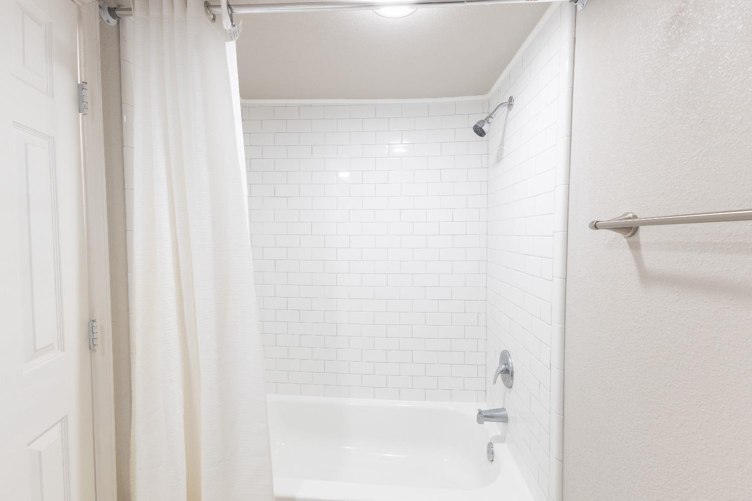 506 40th Street Lubbock, TX 79404 - Photo 10 of 17 a close up of a shower